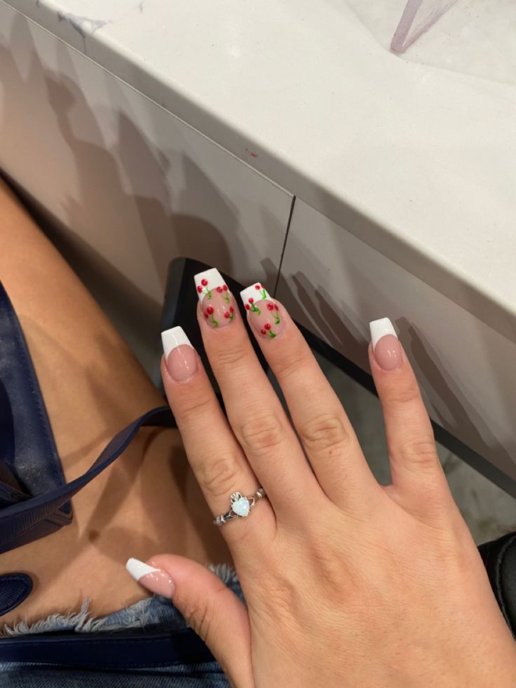 Chic French Tip Nail Design with Playful Floral Accents