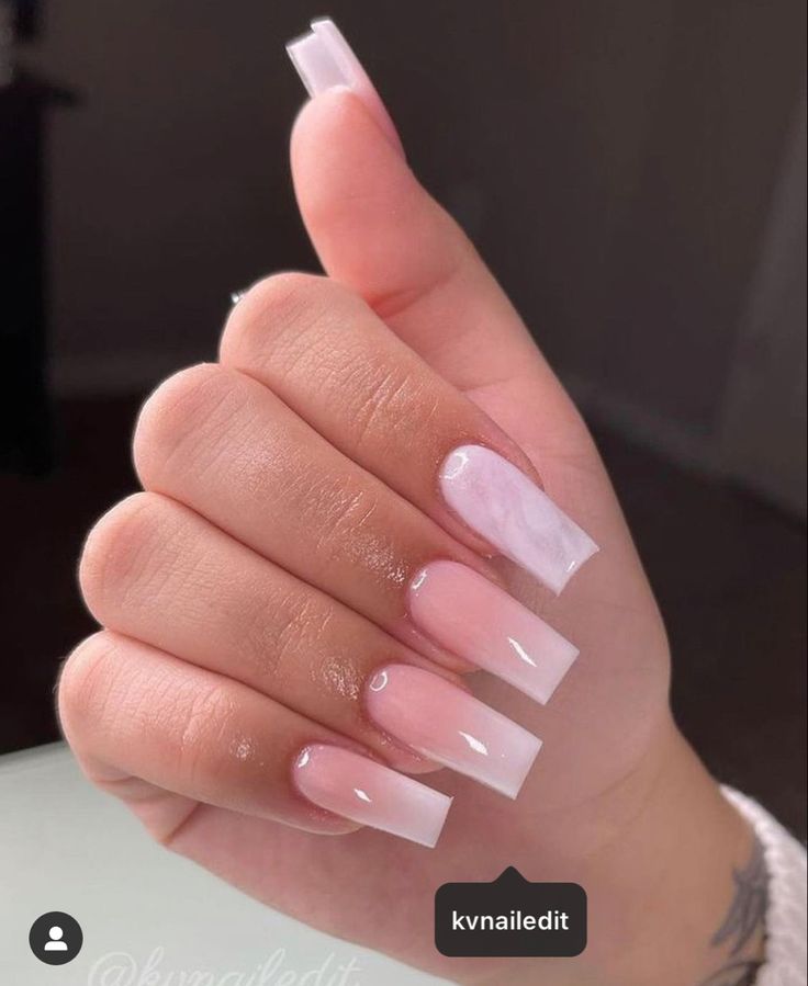 Elegant Ombre Nail Design with Long Acrylics in Soft Pink and Clear Finish.