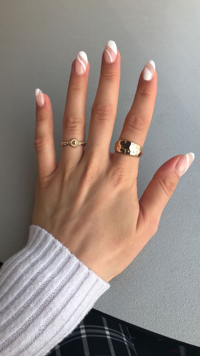 Sophisticated Soft Pink Nail Design with White Geometric Accents and Complementary Rings.