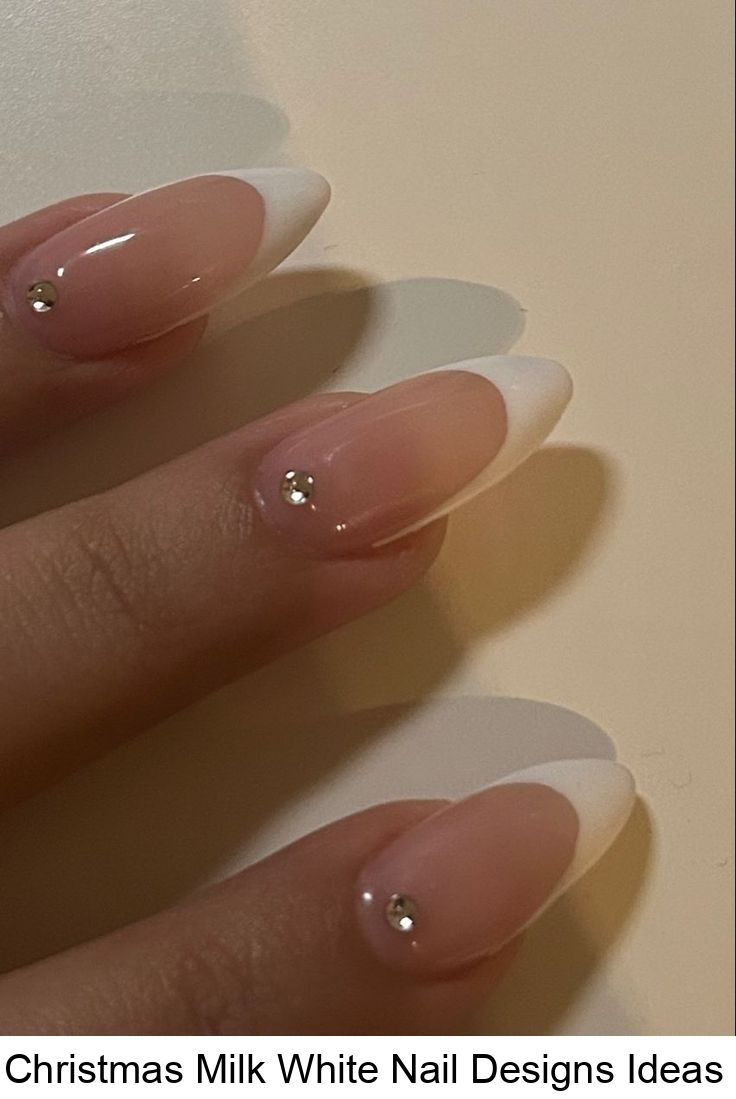 Chic Milk White Nails with Sparkling Gemstone Tips for a Sophisticated Look.