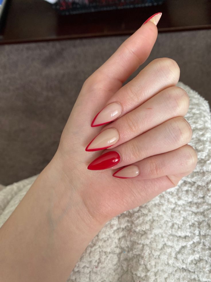 Sophisticated Almond-Shaped Nails: Striking Red and Nude Design.