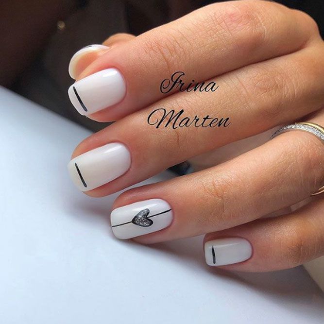 Sophisticated Minimalist Nail Design with Geometric Lines and Heart Detail.