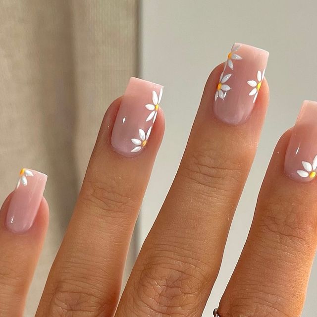 Elegant Pastel Nail Design with Ombre Effect and Floral Accents.