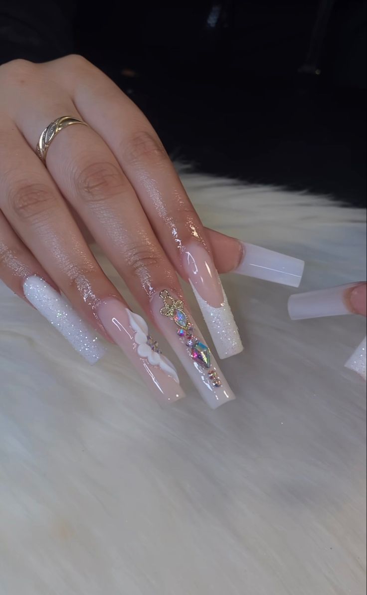 Elegant Pastel Square-Tip Nail Design with Gemstone and Floral Accents.