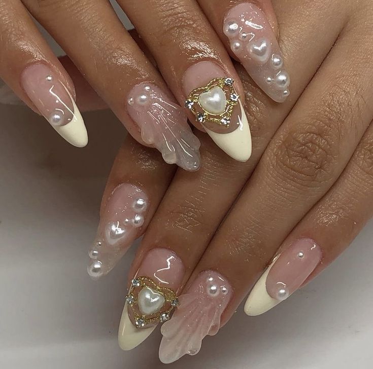 Whimsical Sophistication: Elegant Nail Design with Glossy Pink, Nude Finishes, Faux Pearls, and Heart Embellishments