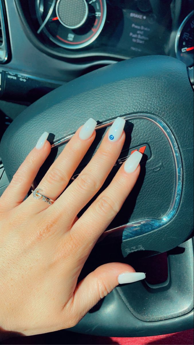 Sophisticated Glossy White Gel Nails with Unique Blue Accent Design