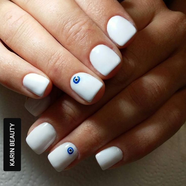 Elegant Glossy White Nails with Minimalist Blue Eye Design