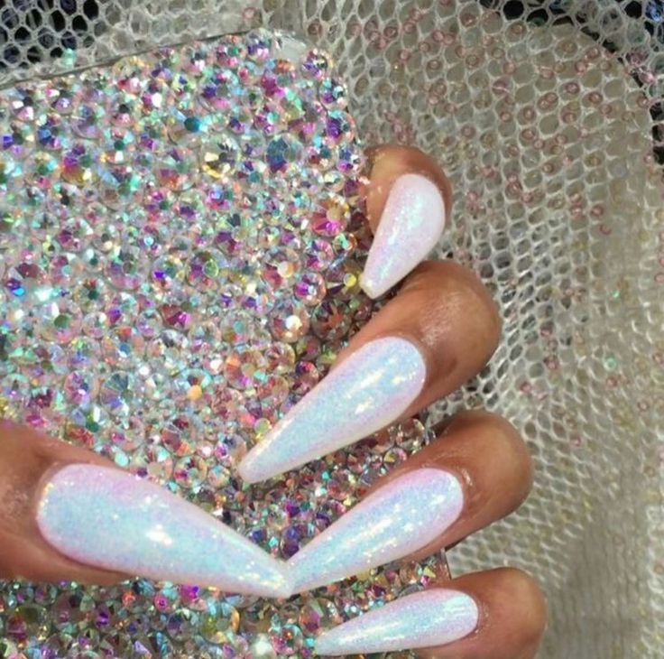 Glamorous Iridescent Almond-Shaped Nail Design with Sparkly Phone Case.