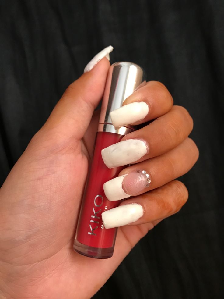 Chic Nail Design: Classic White and Soft Pink with Glamorous Rhinestones and Vibrant Red Accents.