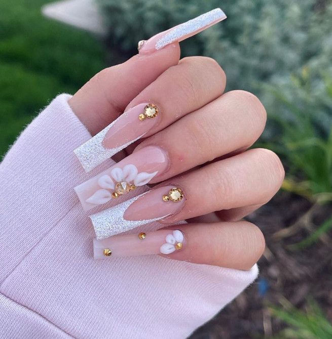 Sophisticated Elegant Nail Design with Elongated Square Tips, Glitter, Pastels, and Floral Accents.