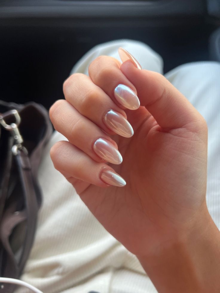 Iridescent Almond-Shaped Nails: A Sophisticated and Whimsical Modern Trend.