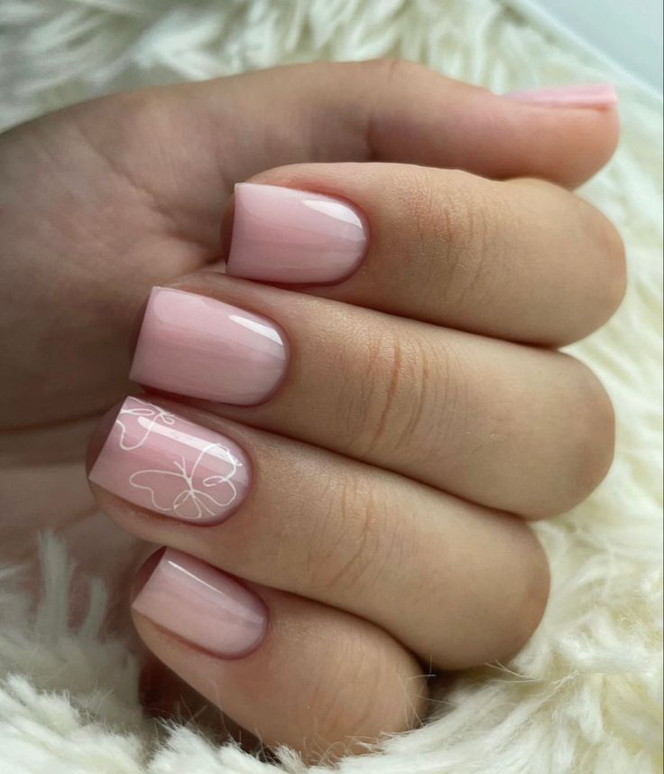 Elegant Pink Manicure with Glossy Finish and Hand-Drawn Floral Accent.