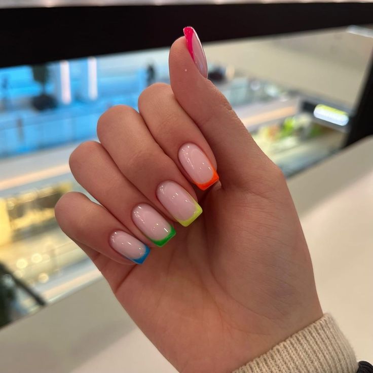 Playful Neon-Tipped Pastel French Manicure: A Chic Modern Twist on Tradition.