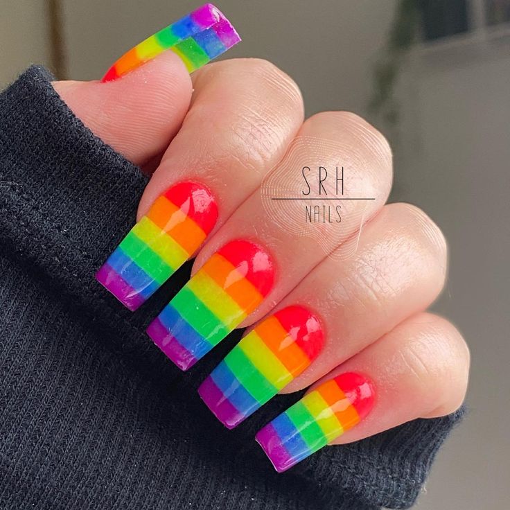 Playful Rainbow Nail Design with Bold Stripes and Glossy Gradient Finish.