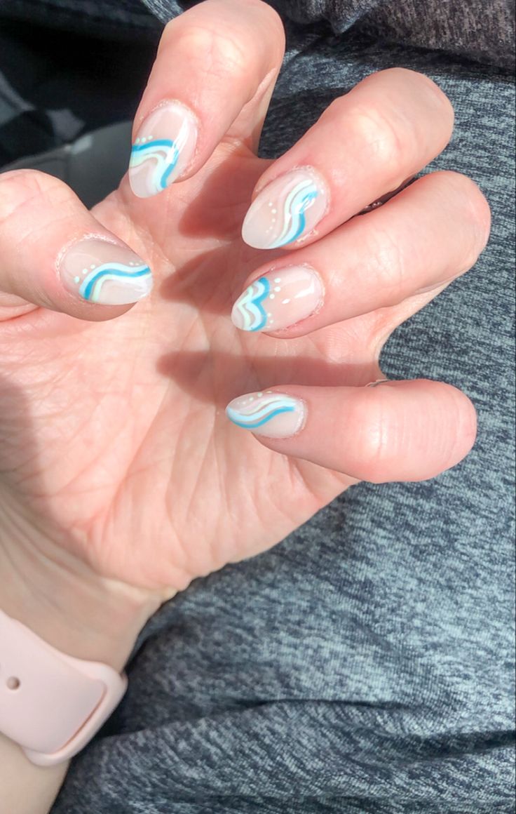 Playful Yet Elegant Soft Color Nail Design with Glossy Beige and Turquoise Waves.