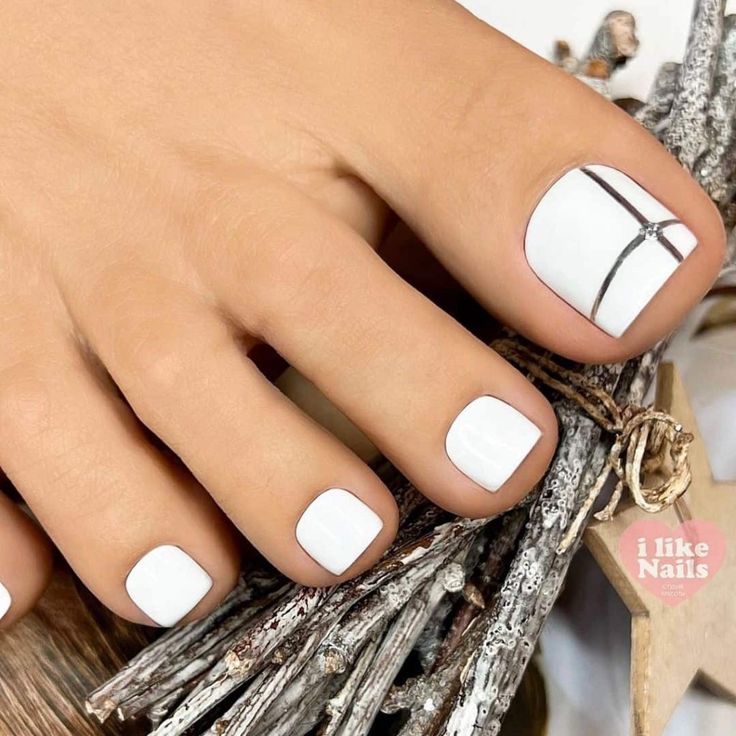 Chic Minimalist White Toenails with Subtle Silver Accent.