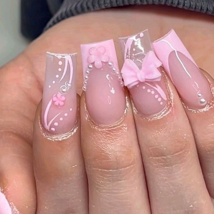 Chic Pink Nail Design with Floral Patterns and Textured Finishes for Any Occasion