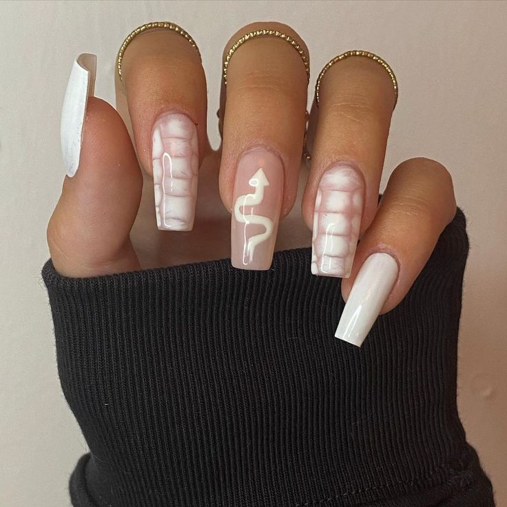 Contemporary Nail Design: Glossy White and Snake Motif with Gradient Effects and Gold Accents.