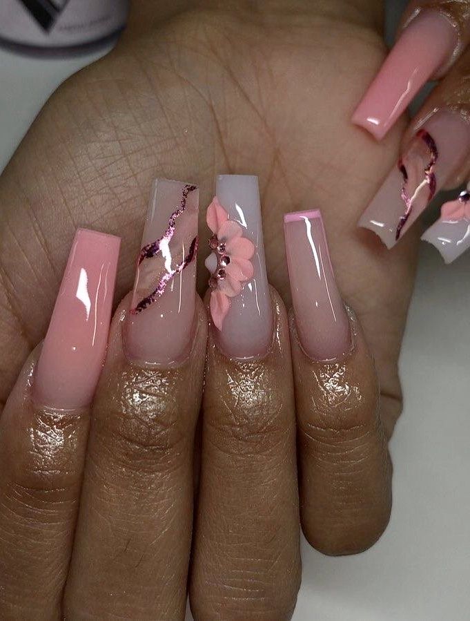 Chic Nail Design: Elegant Soft Pink and Nude Shades with Floral Accents and Metallic Lines