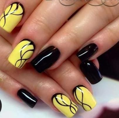 Striking Bold Nail Design: Alternating Black and Bright Yellow with Elegant Black Swirls.