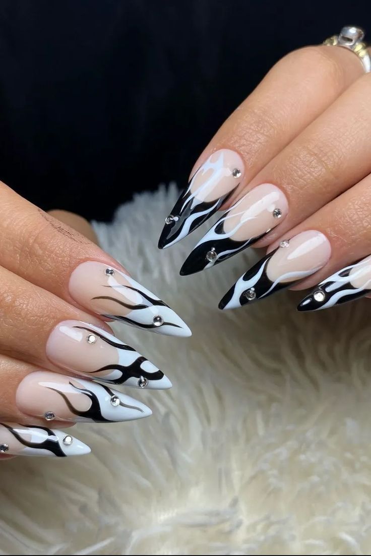 Bold Flame-Inspired Nail Design: A Striking Blend of Black, White, and Sparkling Rhinestones