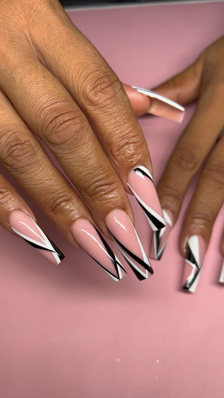 Chic Geometric Nail Design: Soft Pink Base with Bold Black Accents