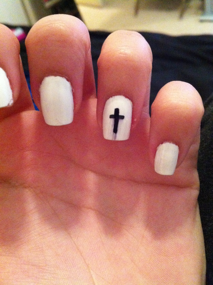 Elegant White Nail Design with Minimalist Black Cross Accents.