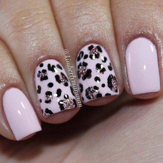 Chic Statement Manicure: Soft Pink with Playful Black Leopard Spots and Metallic Gold Accents.