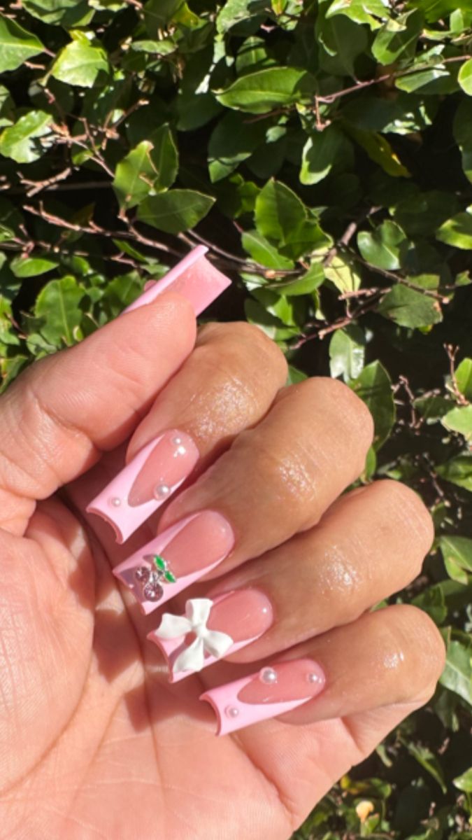 Elegant Pink Nail Design with Pastel Hues, Glossy Accents, and Intricate Details