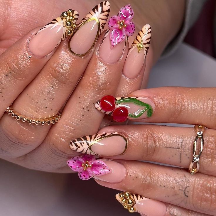 Vibrant Floral and Fruity Exotic Nail Design with Tropical Patterns and Gold Accents.