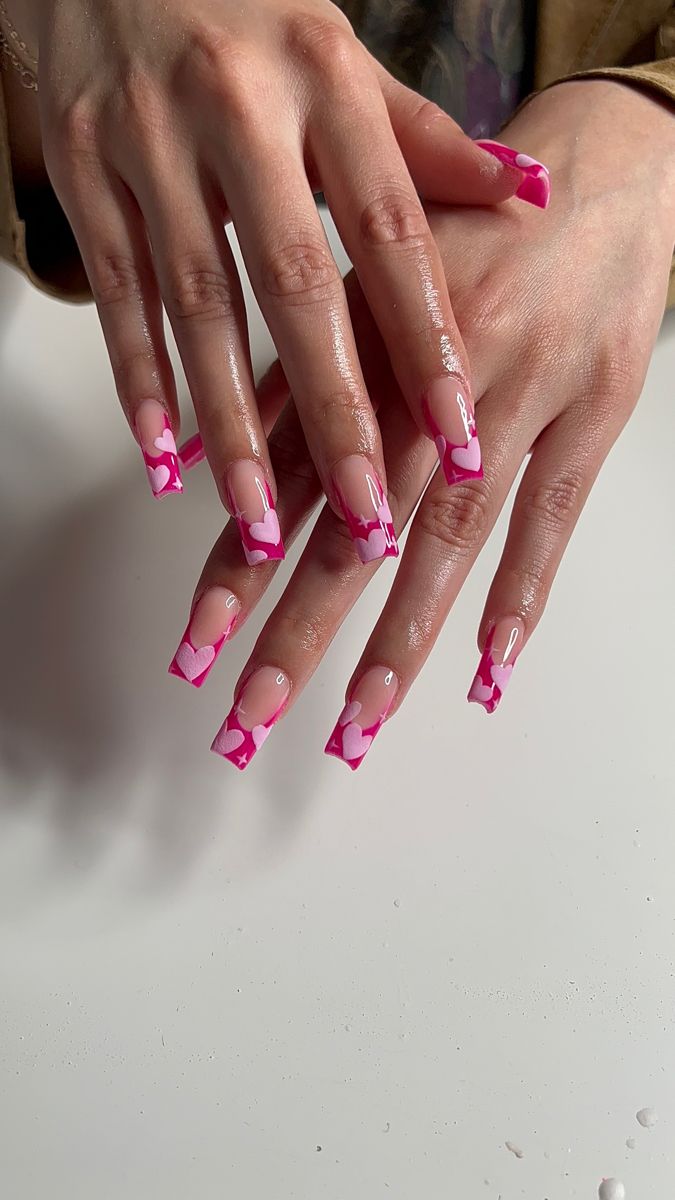 Chic Pink and Nude Heart-Shaped Nail Design for Special Occasions.