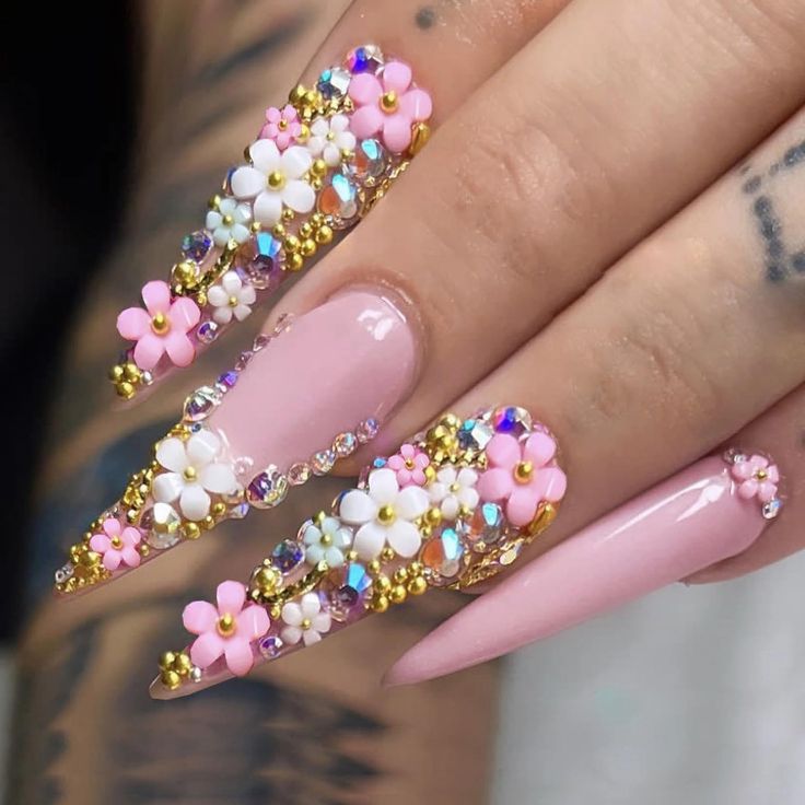 Elegant Floral-Inspired Nail Design with Pastel Colors and Glamorous Accents