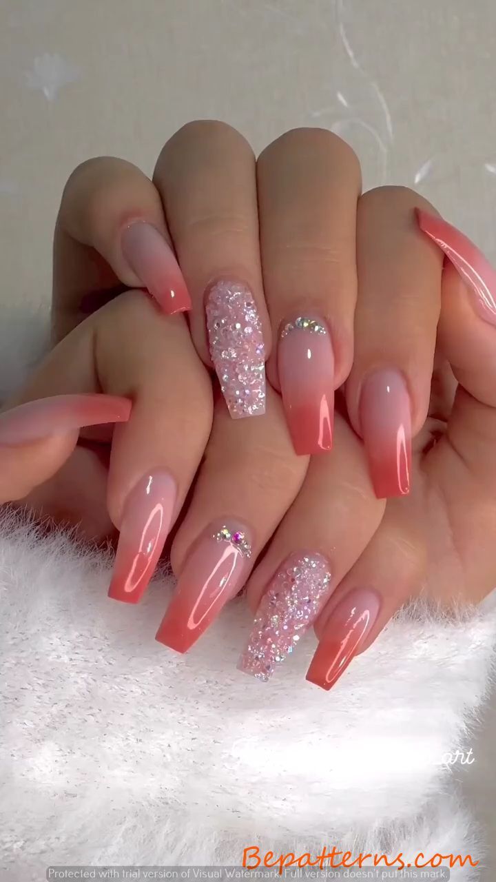 Elegant Ombre Nail Design in Soft Pinks and Coral with Glitter Accents for All Occasions.