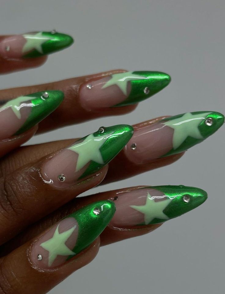 Striking Green and Nude Nail Design with Bold Star Patterns and Glamorous Accents.