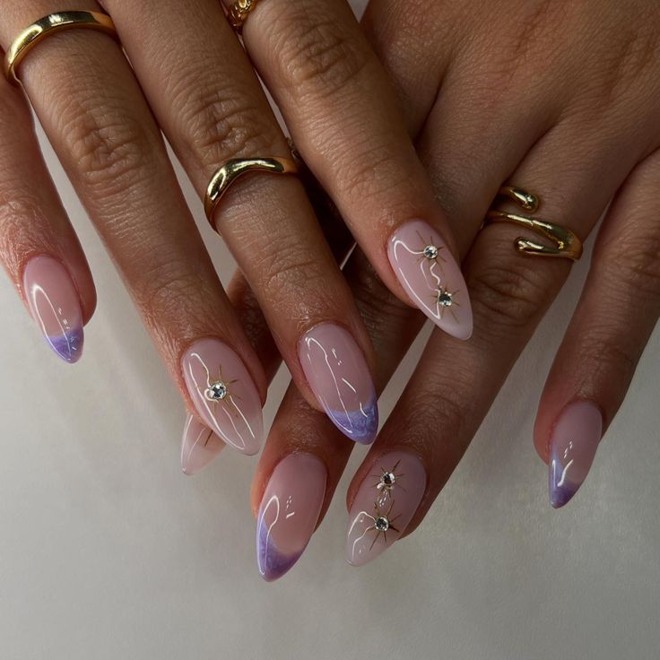 Chic Ombre Nail Design with Floral Accents and Gemstones