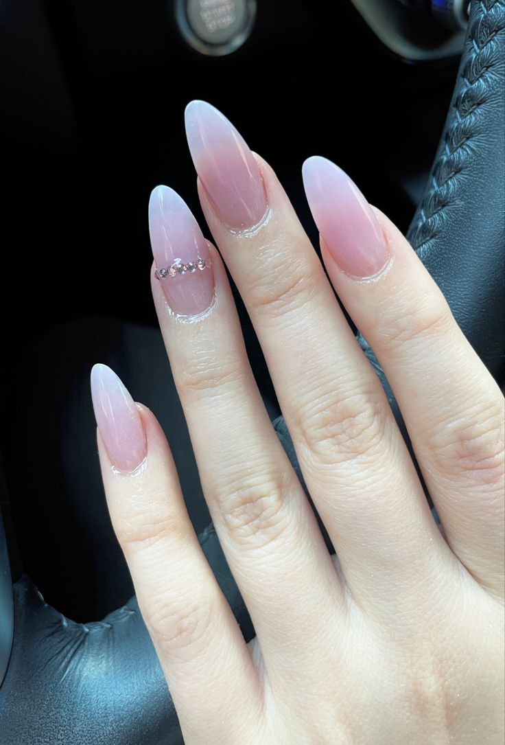 Sophisticated Almond-Shaped Nails with Gradient and Sparkling Silver Accent.