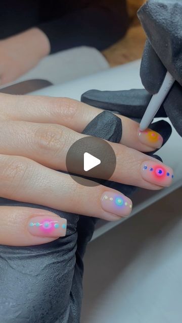 Whimsical Pastel Dot Nail Art: A Creative Expression of Colorful Designs.