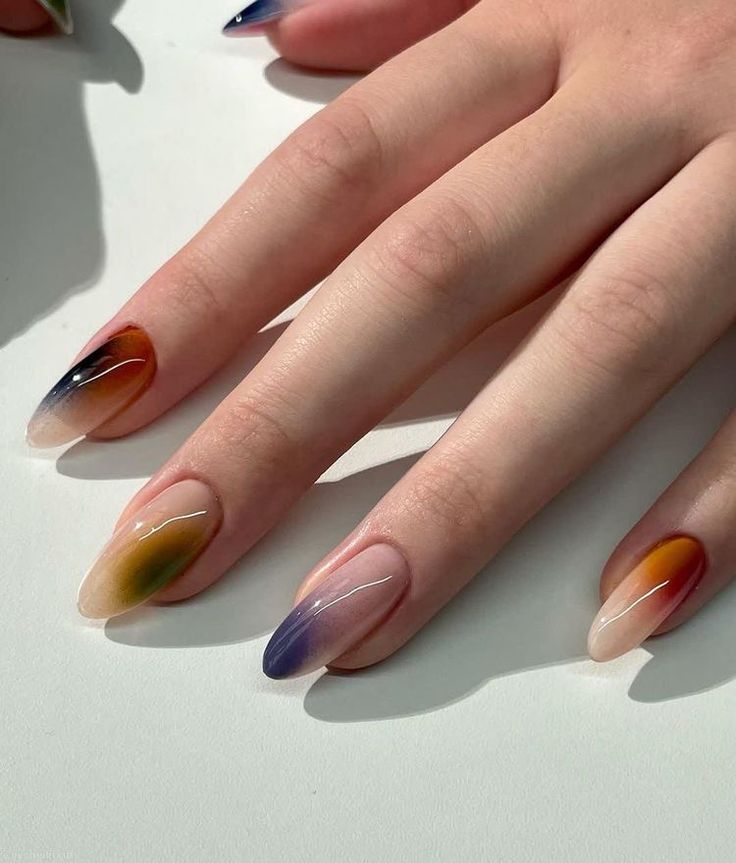 Vibrant Gradient Nail Design with Unique Color Transitions and Glossy Finish.