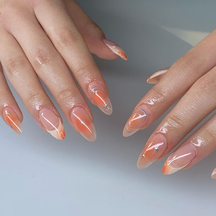 Chic Gradient Orange Nail Design with Elegant Swirls and Glossy Finish