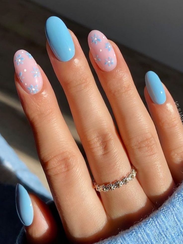 Whimsical Pastel Nail Design with Soft Blue and Pink Hues.