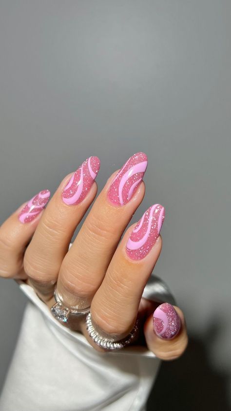 Playful Pink Glitter Nail Design: A Dynamic Blend of Fun and Elegance.