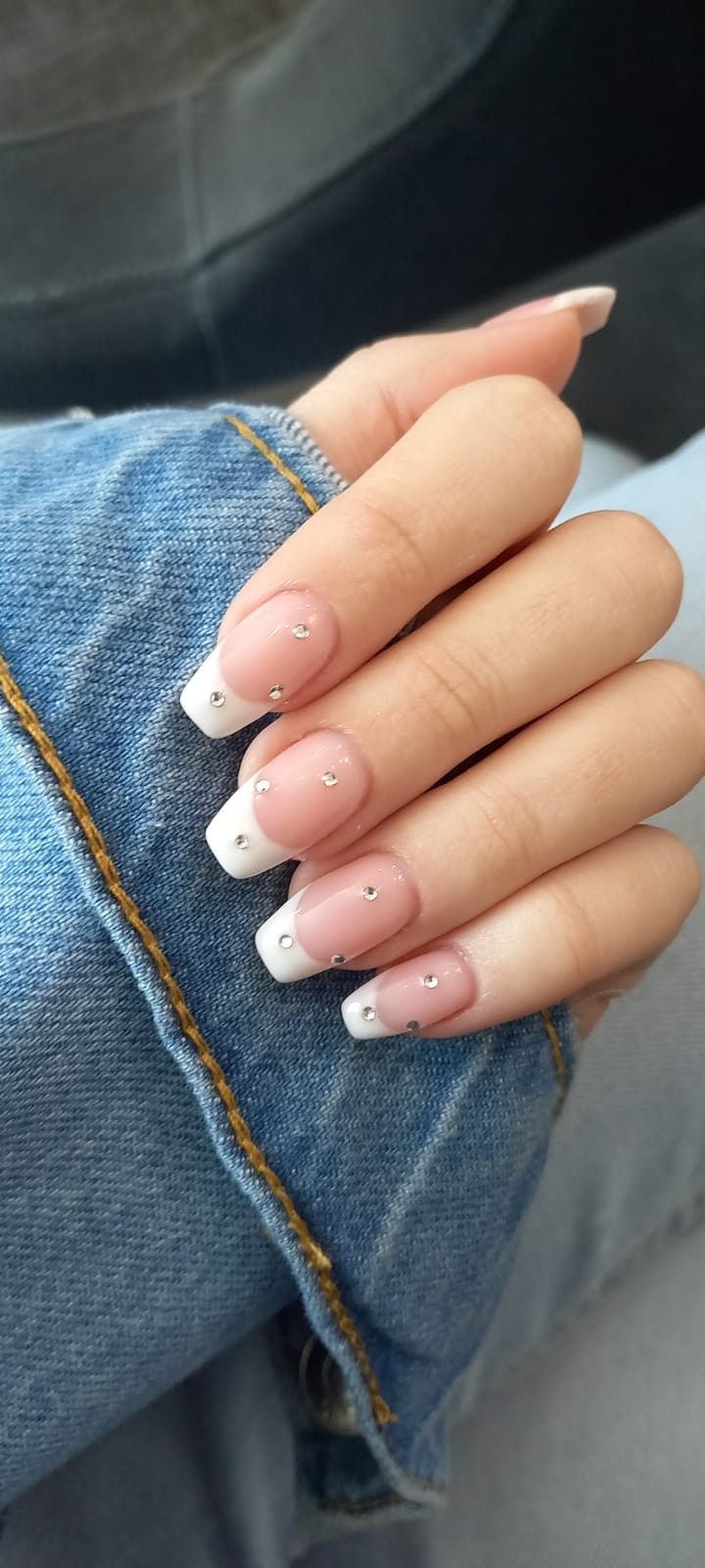 Elegant French Tip Manicure with Modern Rhinestone Accents