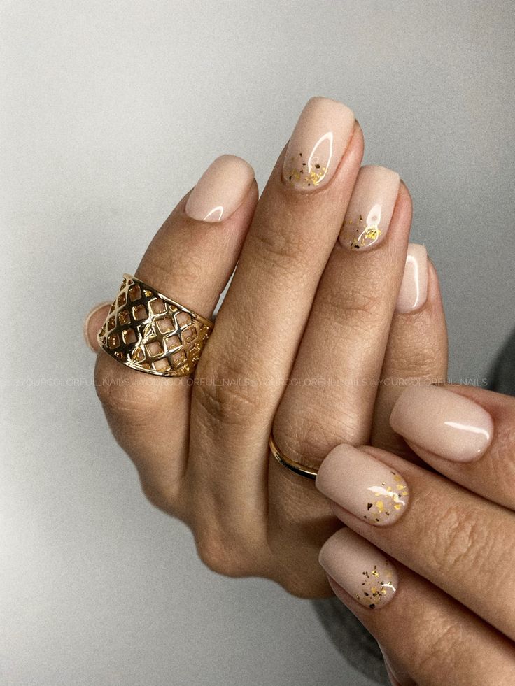 Refined Elegance: Nude Nails Enhanced with Delicate Gold Accents