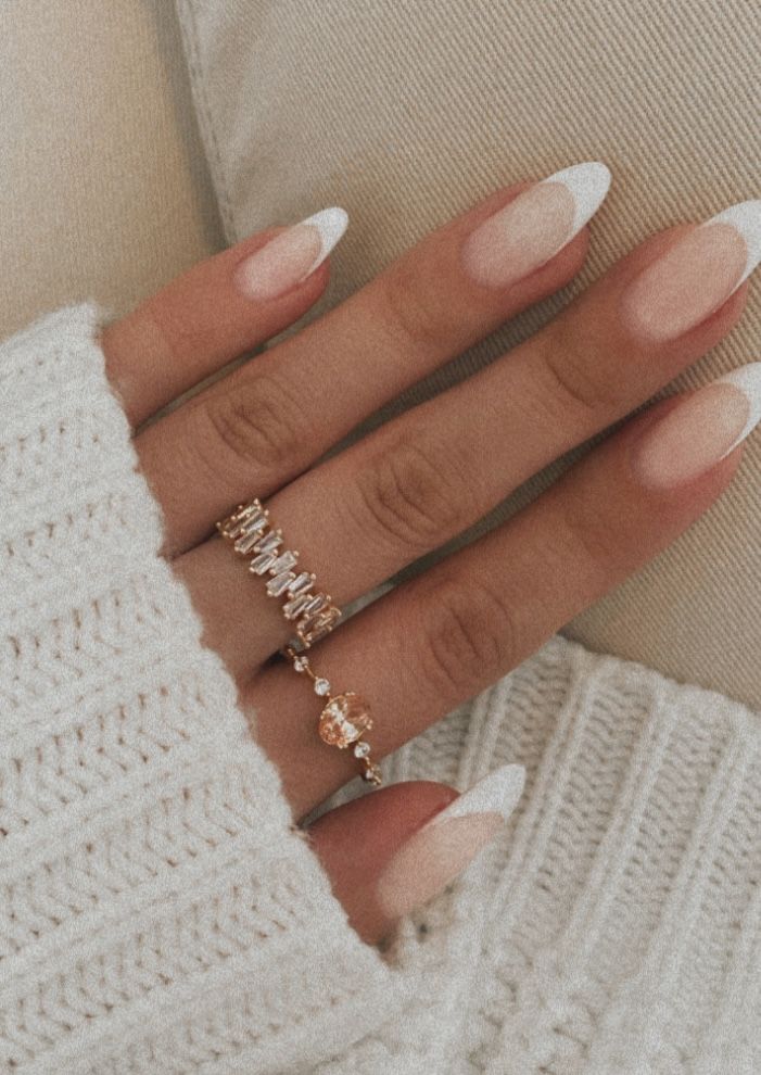 Chic and Elegant Gradient French Tip Nail Design with Delicate Rings.