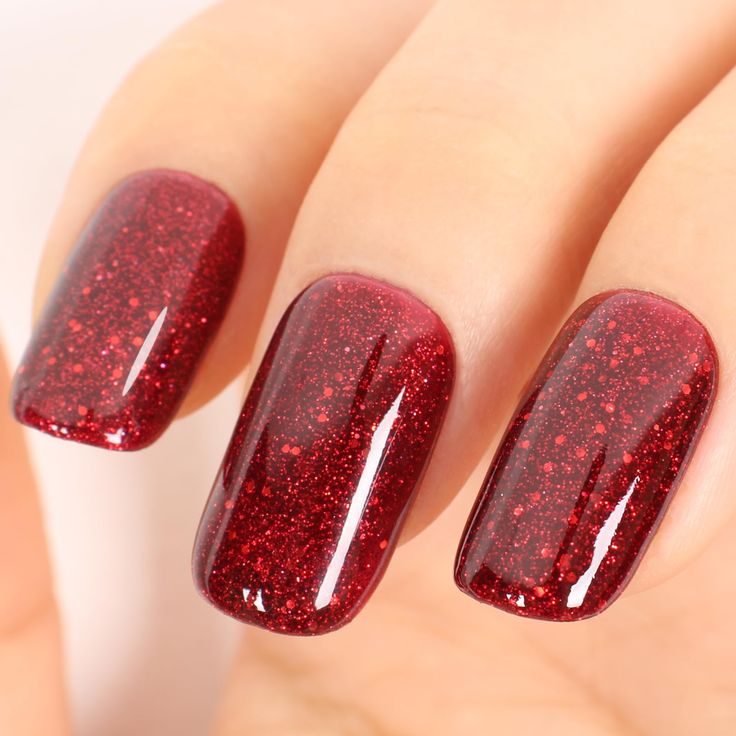 Bold Glamour: Glittering Crimson Nails with a Radiant Finish