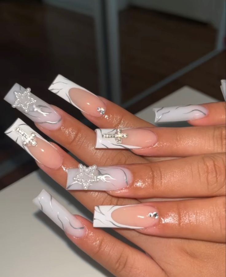 Sophisticated Long Squared Nail Design with Translucent and White Finishes Enhanced by Glamorous Charms and Line Art.