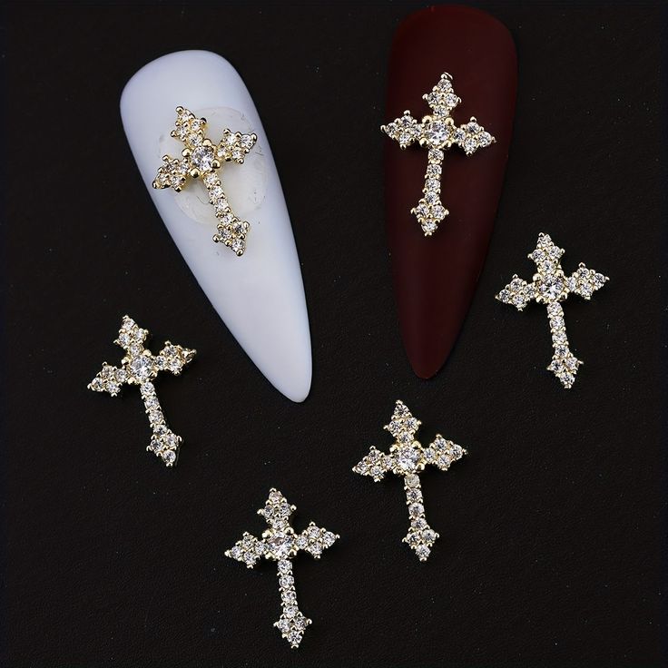 Sophisticated Cross-Shaped Nail Art with Striking Contrasts and Luxurious Gold Accents.