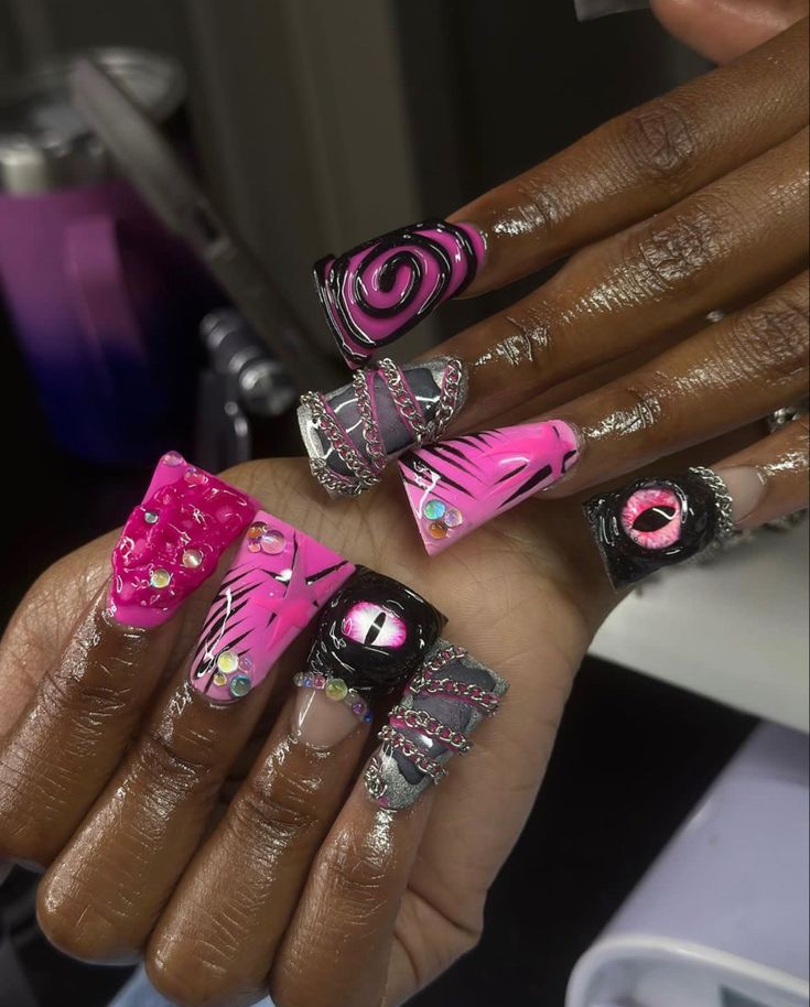 Vibrant Bold Nail Design with Intricate Patterns and Glamorous Accents.