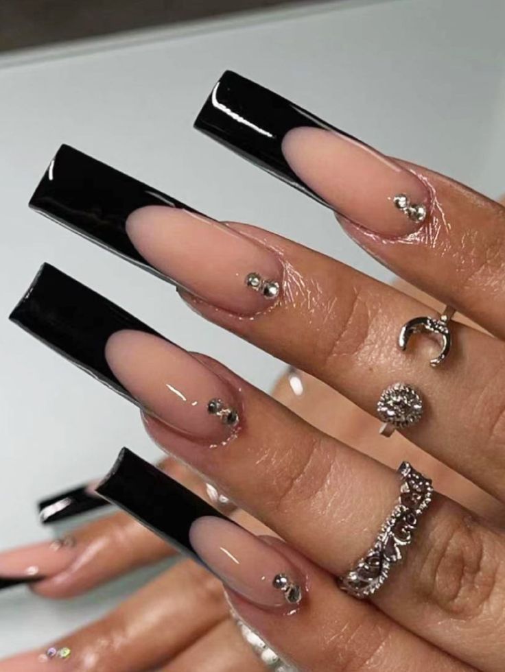 Chic Nail Design: Glossy Black Long Acrylics with Nude Ombre and Glamorous Rhinestone Accents