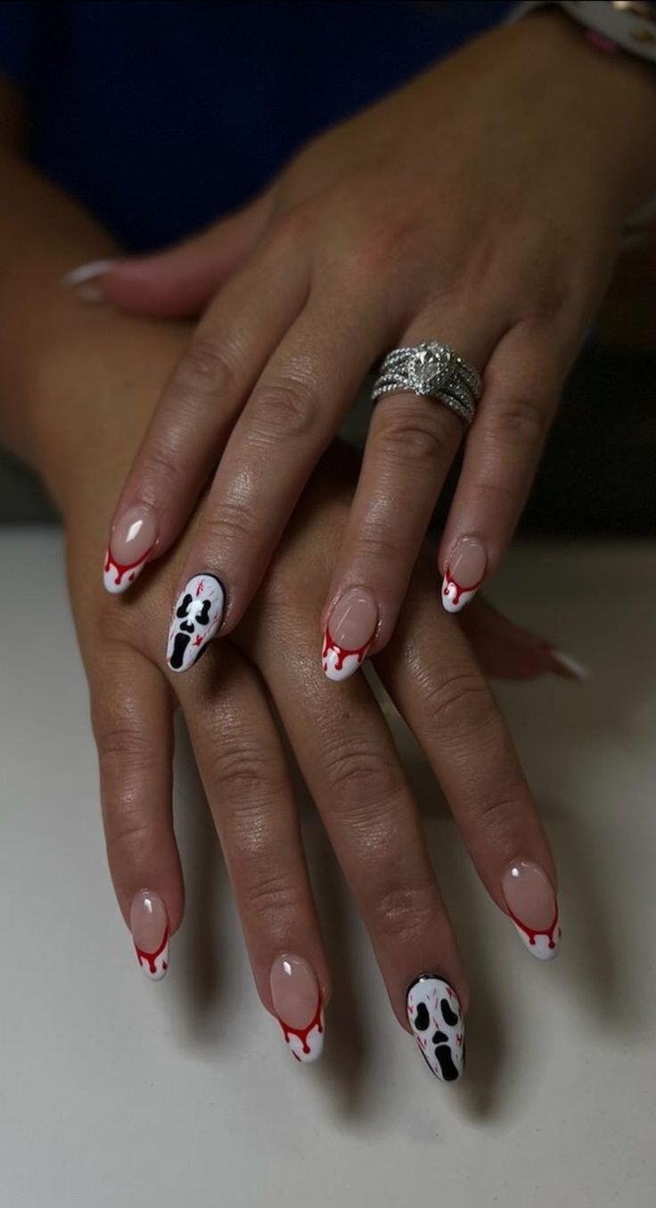 Halloween-Inspired Spooky Nail Design with Glossy White, Translucent Bases, Blood-Dripping Accents, and Intricate Ghost Motifs.